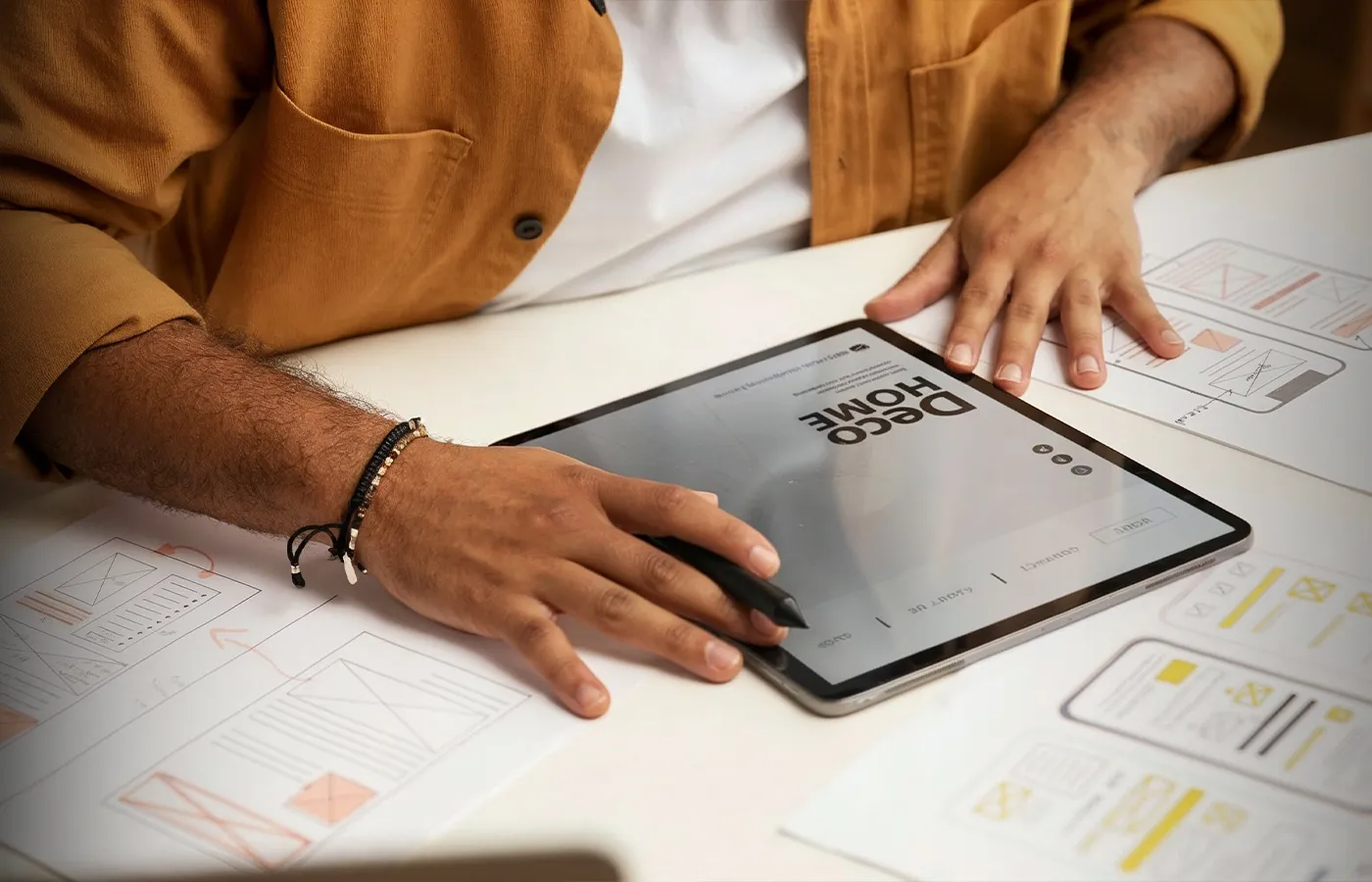 Web application interface and product screens shown on a laptop