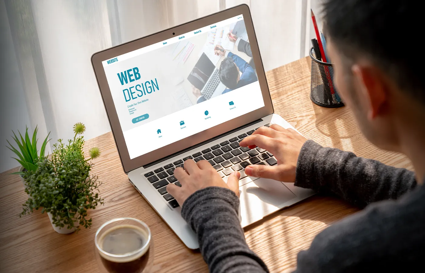 Laptop displaying a live website layout for website design work
